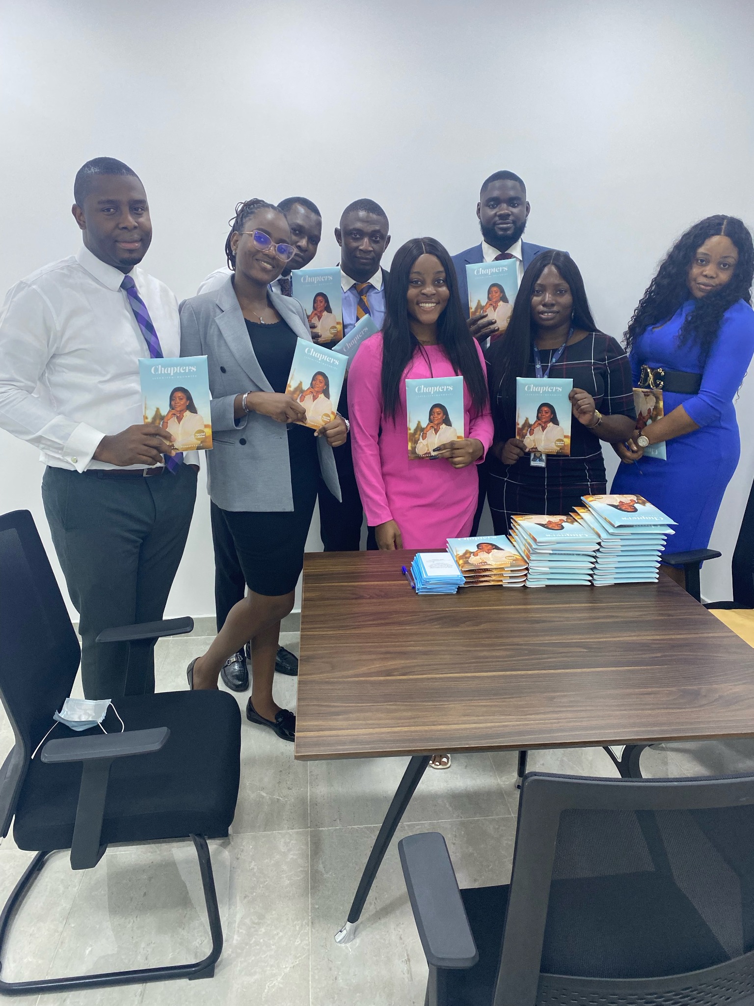 Group photo of a CHAPTERS deployment team holding books.